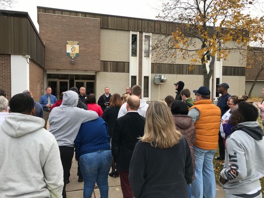 Oshkosh Police Department officials address a crowd of North parents after the lockdown on November 1. (USA TODAY Network-Wisconsin photo)