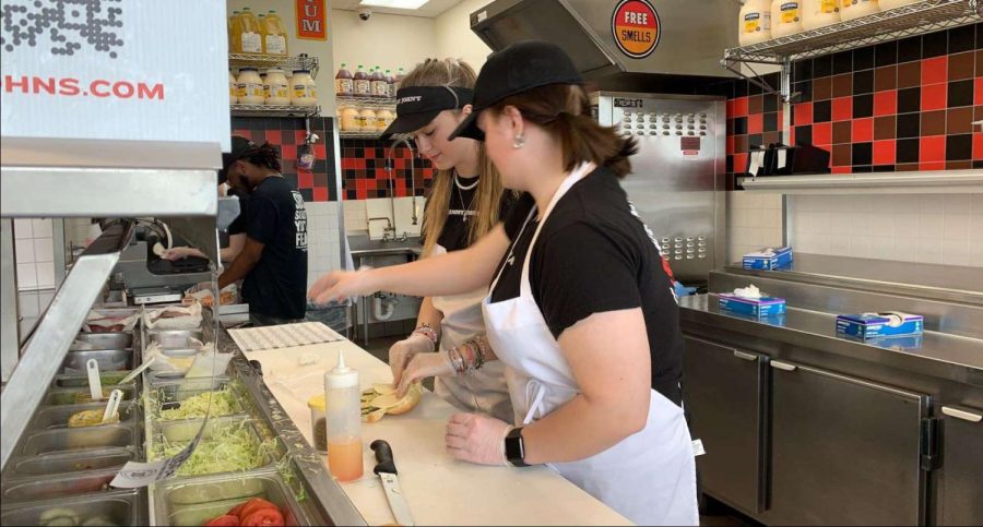 Oshkosh Sophomore Lizzy Scharpf makes a sandwich at Jimmy Johns on Saturday April 23. Many high schoolers have found increased opportunities in post-COVID job market.