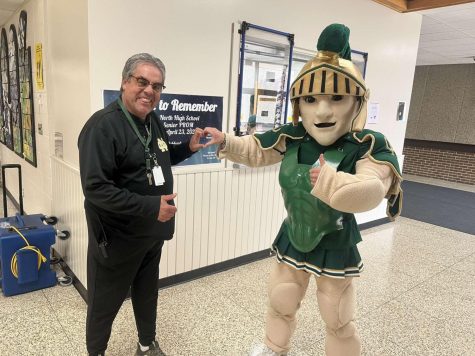 Oshkosh Norths mascot, Sparty, makes a heart with soon-to-be-retired study hall supervisor Robert Whitaker.