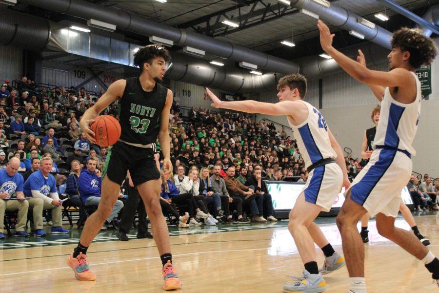 Junior Xzavion Mitchell looks to drive against the Oshkosh West Wildcats on Jan. 20, 2023.