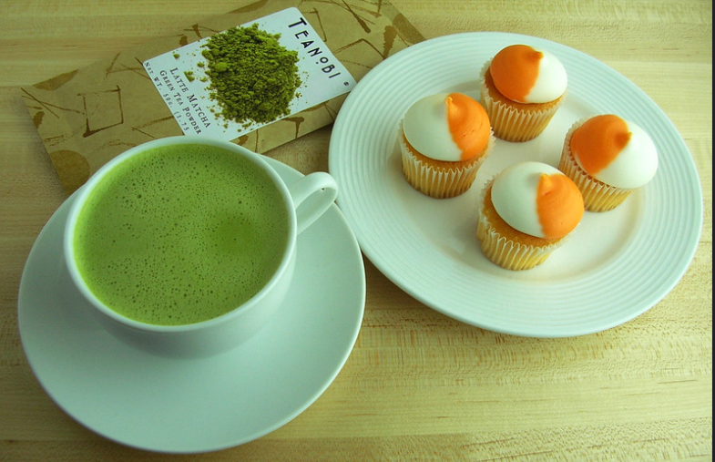 "Matcha Latte with Orange Cream Frosted Cupcakes." by Kirinohana is licensed under CC BY 2.0.